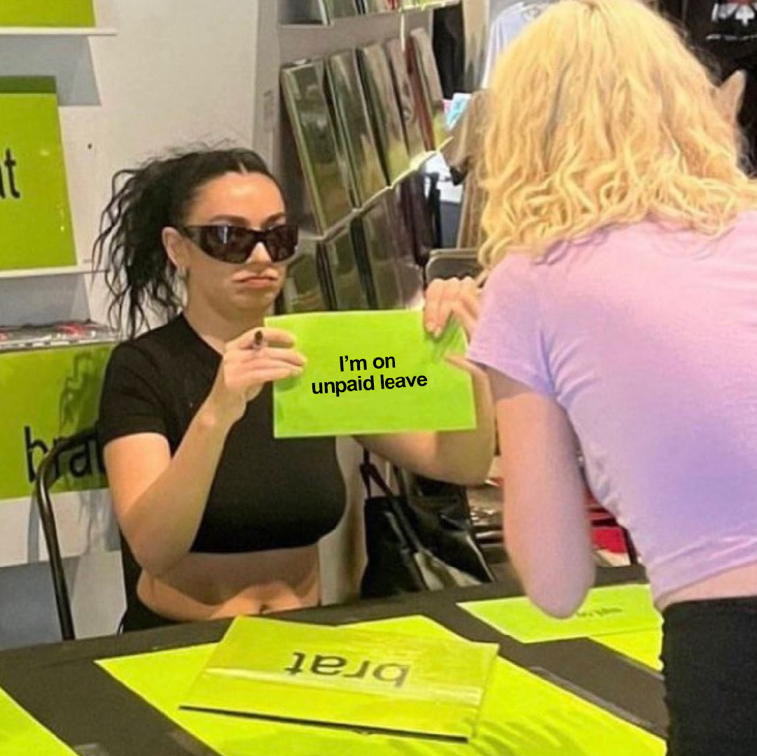 Woman holding up sign saying 'I'm on unpaid leave'