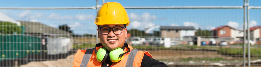 Man in high-vis on work site