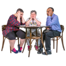 A group of people sitting at a table looking frustrated and upset