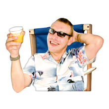 A person on holiday smiling and leaning back on a deck chair