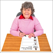 A person looking over a form and smiling