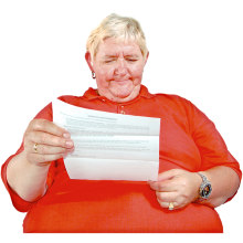 A person concentrating on a letter that they are reading