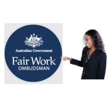 A Fair Work Ombudsman employee pointing to the Fair Work Ombudsman logo