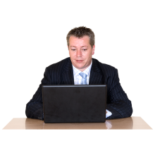 A Fair Work Ombudsman employee typing on a black laptop